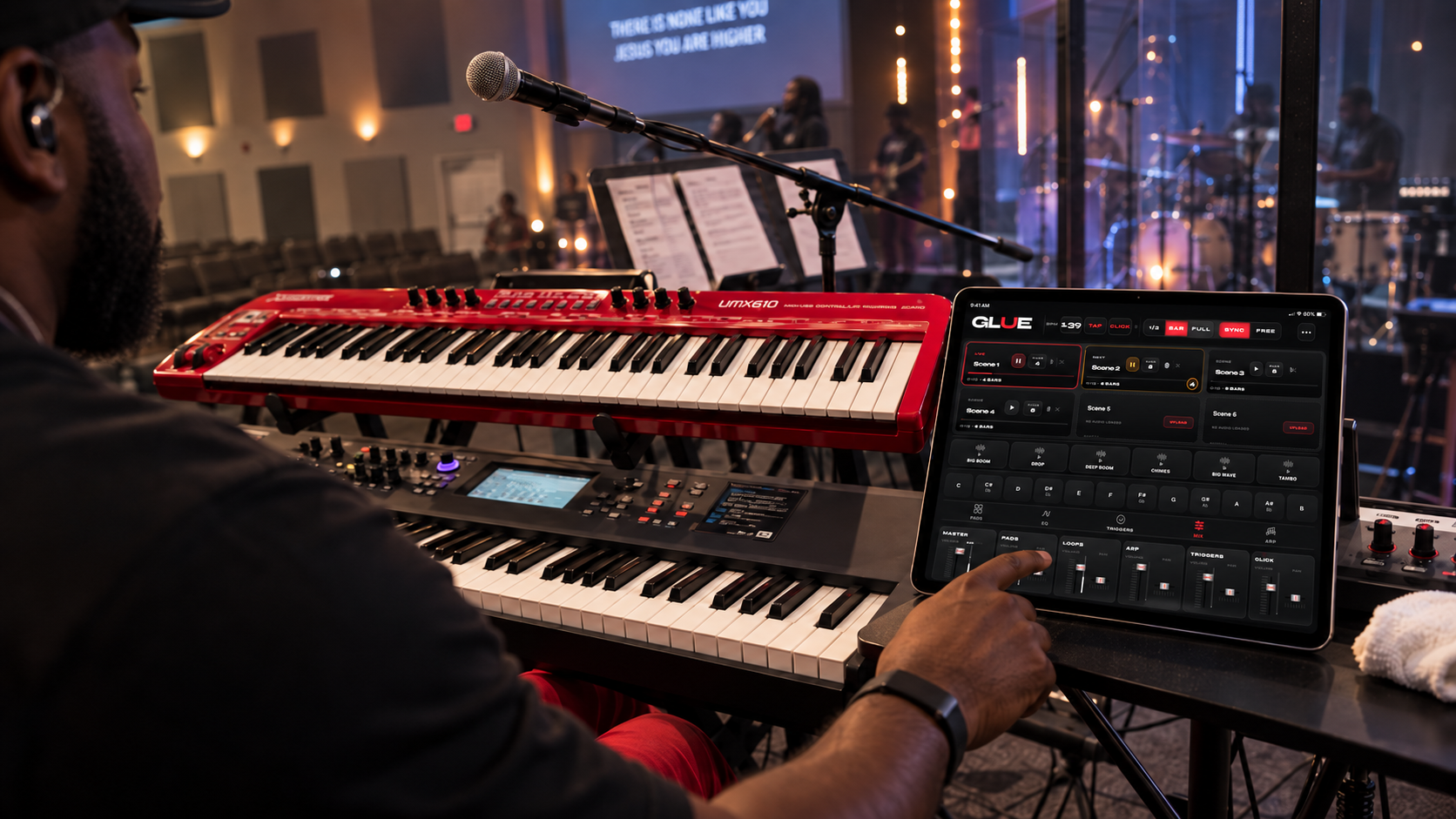 Musician using Glue on an iPad above a keyboard